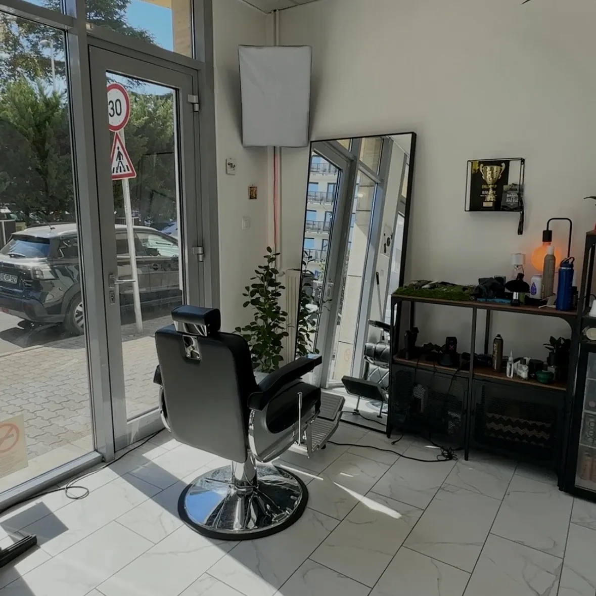 Barber chair by the window at TEXTURA Salon